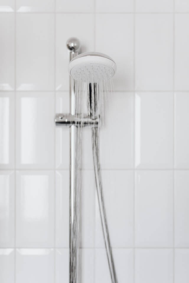 Shower head dispensing hot water